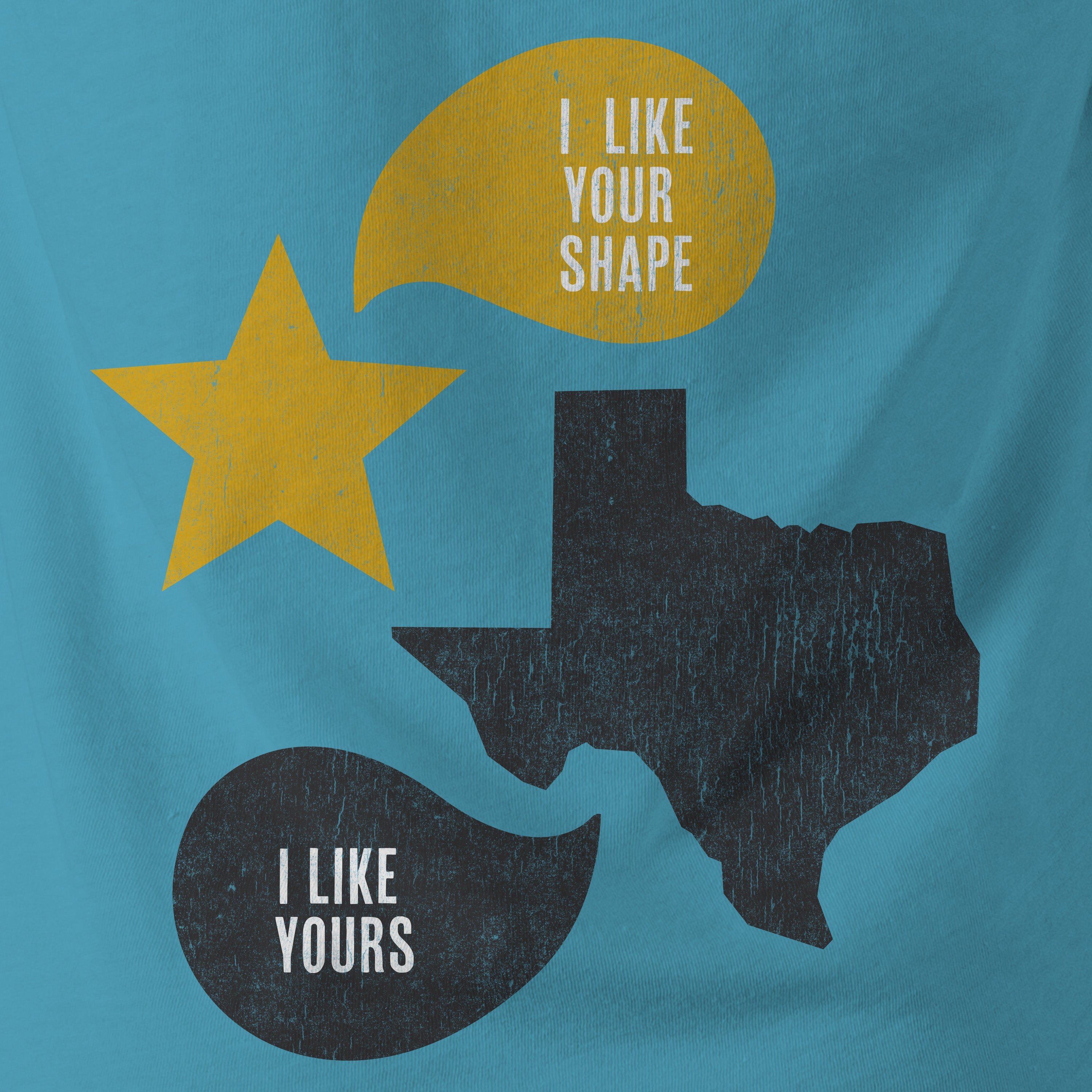 A close-up photo of a blue colored graphic t-shirt with Texas artwork inspired by the movie Fandango