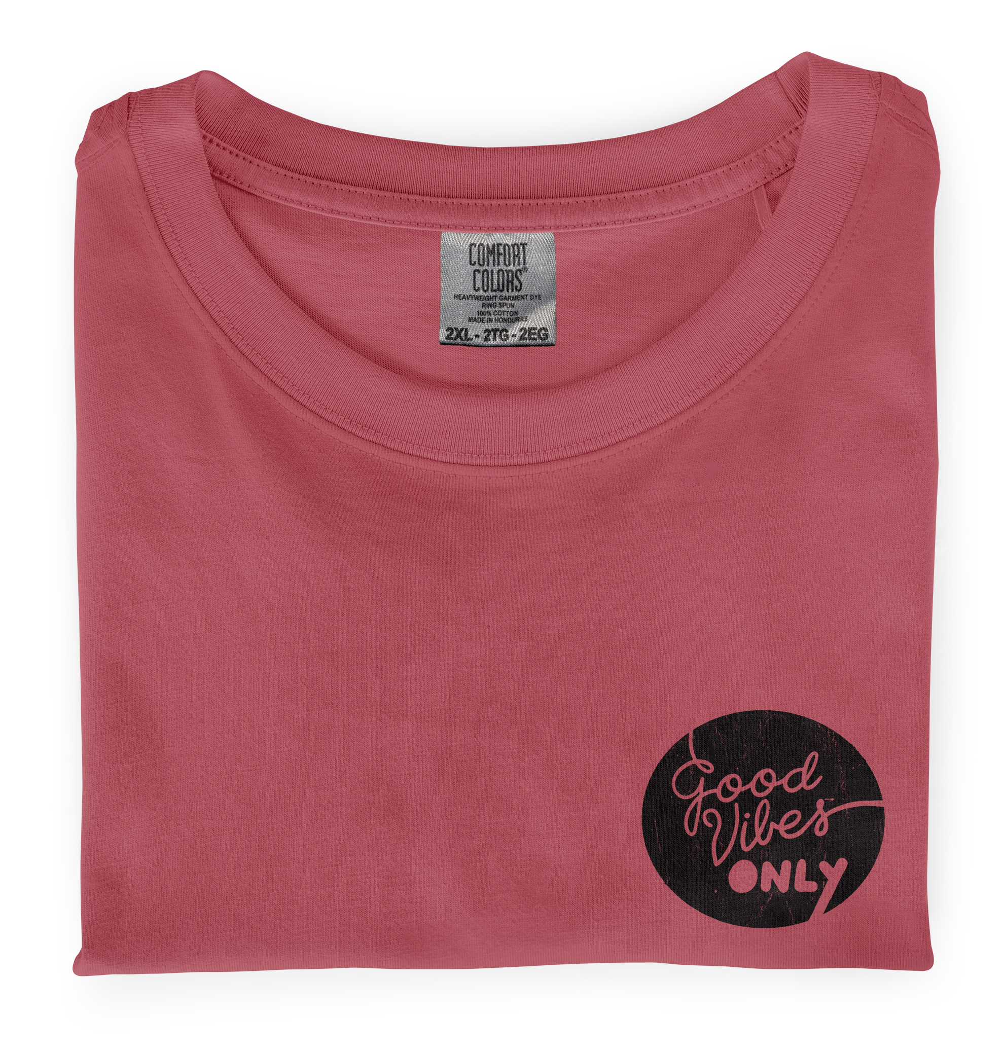 A close-up photo of a Watermelon colored Comfort Colors T-shirt with a screen printed graphic heart print on the front.