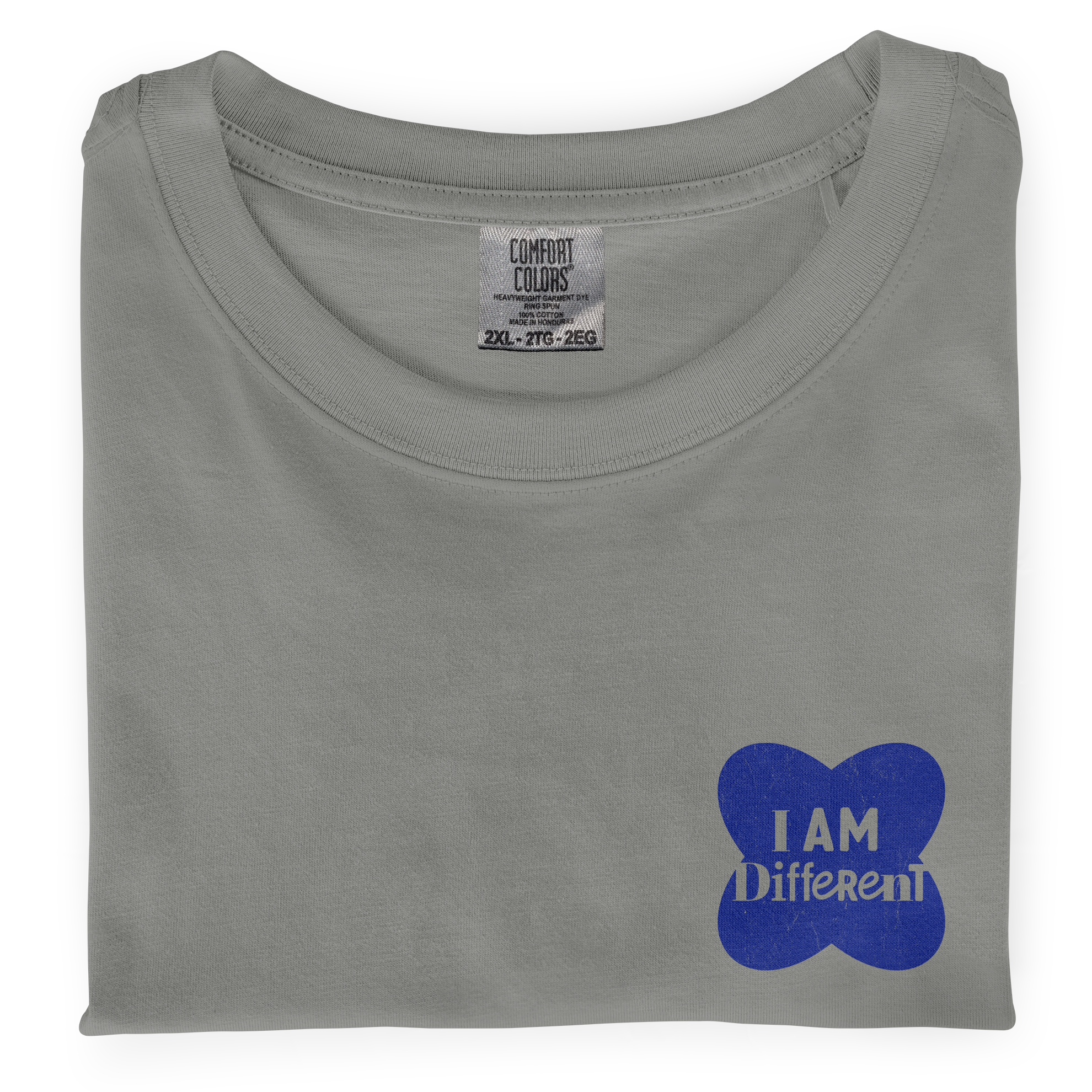 Close-up photo of a folded grey colored t-shirt with a graphic printed on the front chest that says I Am Different.