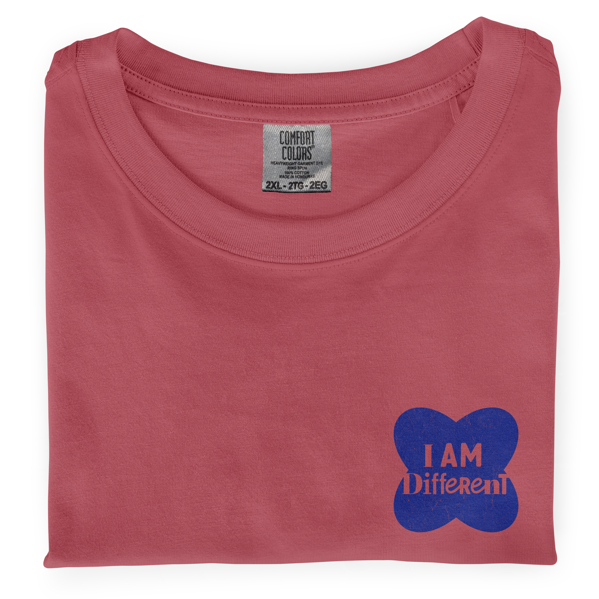 Close-up photo of a folded watermelon colored t-shirt with a graphic printed on the front chest that says I Am Different.