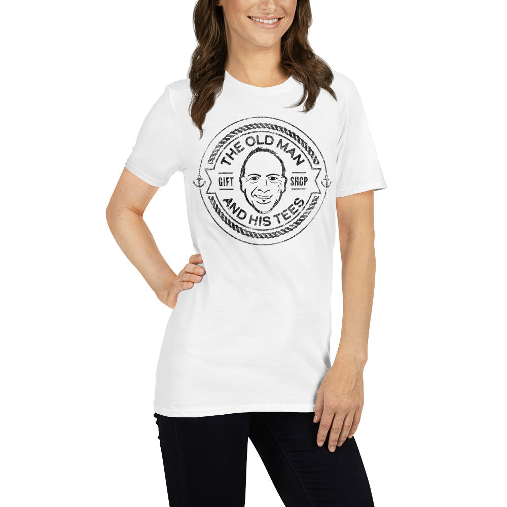 A picture of a young woman wearing a white Tshirt with vintage stamp of logo for The Old Man and His Tees Gift Shop